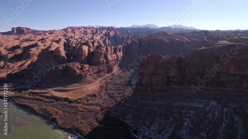 Aerial view of Kane Creek canyon and fins at Behind the Rocks moving over the Colorado River towards the La Sal Mountains in Moab Utah. photo