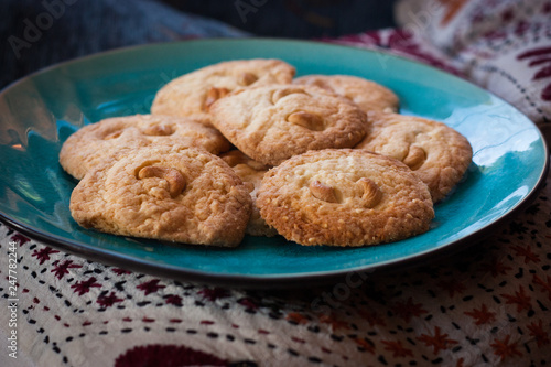home-made cashew nut cookies, grandma's style on blue plate