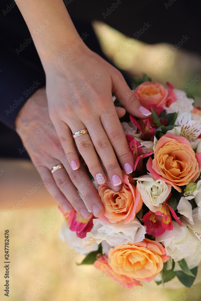 hands of husband and wife with wedding rings. hands of husband and wife with wedding rings.