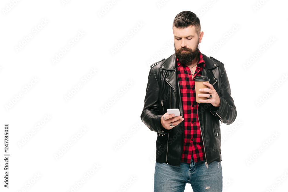 bearded man in black leather jacket holding coffee to go and using smartphone, isolated on white bearded man in black leather jacket holding coffee to go and using smartphone, isolated on white