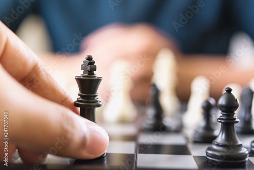 Businessman play with chess game. concept of business strategy and leadership
