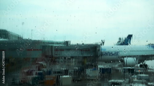 Waiting to board a plane on a moody, rainy day photo