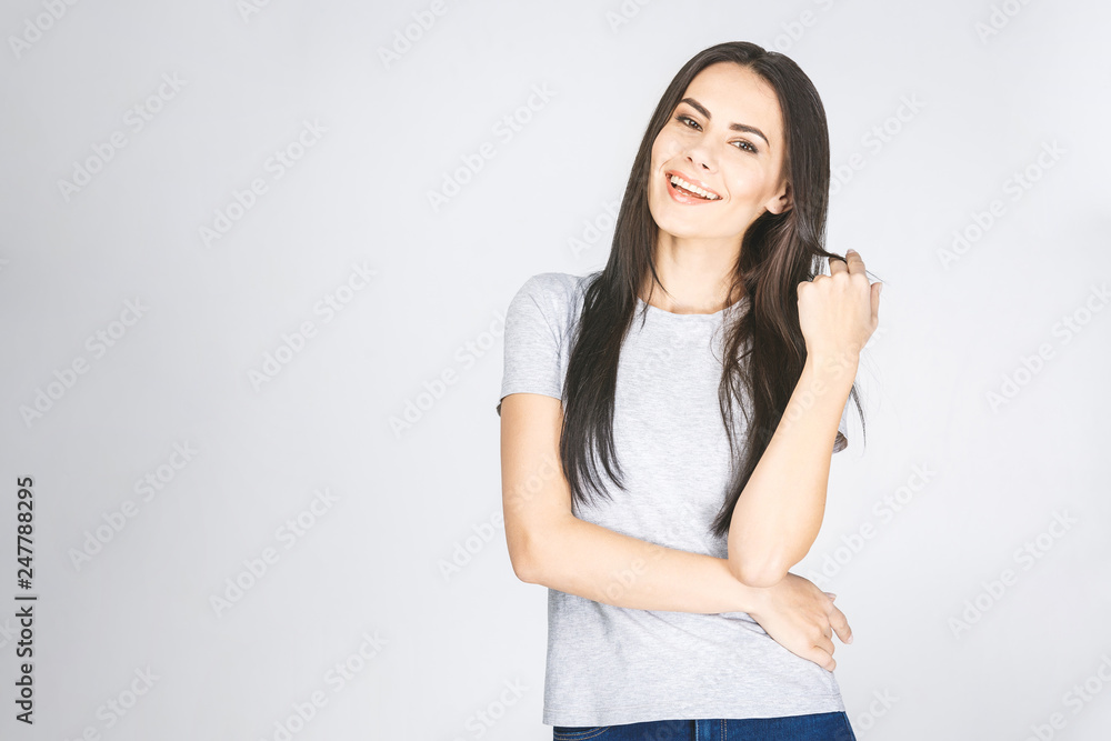 Attractive woman with long brown being very glad smiling with broad smile showing her perfect teeth having fun indoors. Isolated over white. Attractive woman with long brown being very glad smiling with broad smile showing her perfect teeth having fun indoors. Isolated over white.