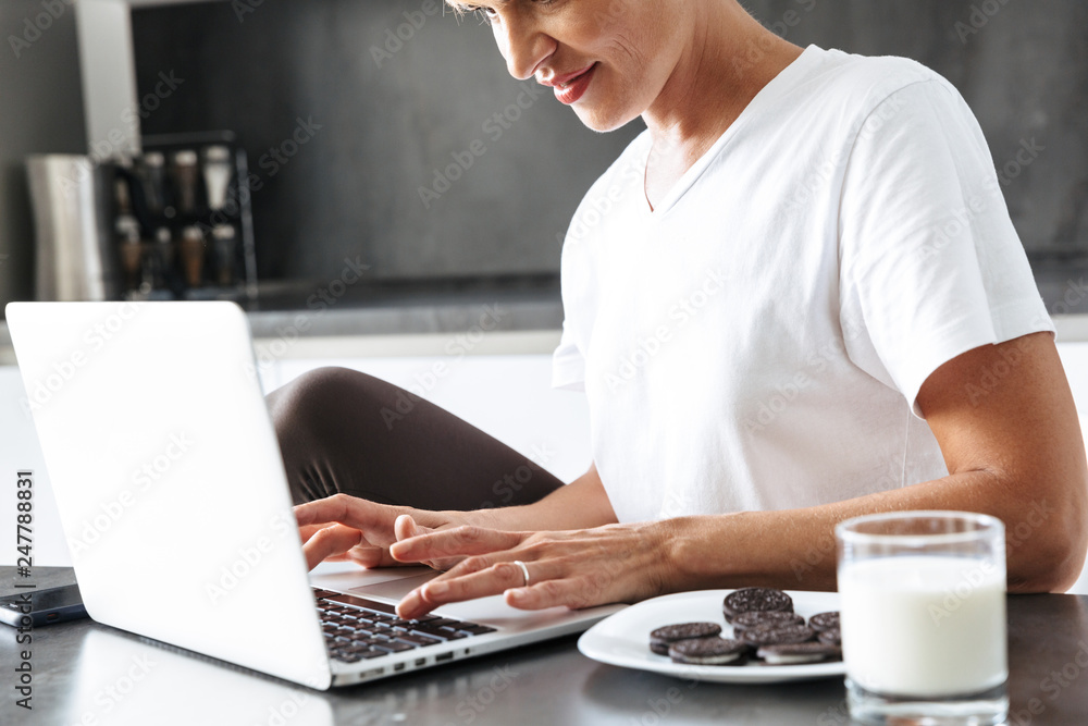 Pretty woman using laptop computer Pretty woman using laptop computer