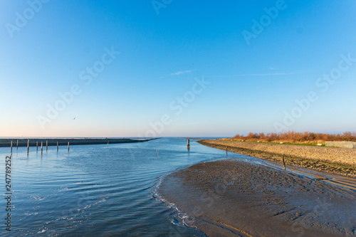 Niedrigwasser im Hafen von Bensersiel Ostfriesland photo