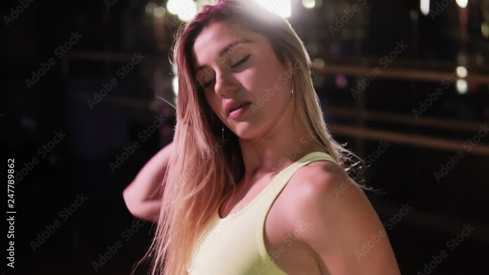 Video Stock A young girl is a go-go or twerk dancer. A slender girl performs a dance. Soffits