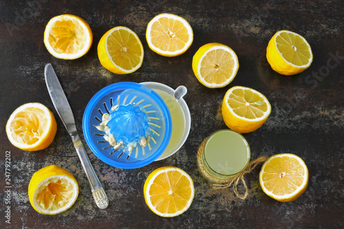 Freshly squeezed lemon juice. Lemon Fresh. Lemons. Lemon halves. The concept of weight loss with lemon juice.