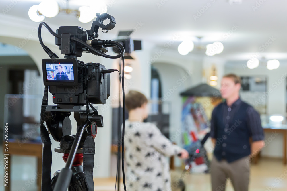 Video of the interview. Television equipment, camcorder with LCD screen, lighting equipment. Video of the interview. Television equipment, camcorder with LCD screen, lighting equipment.