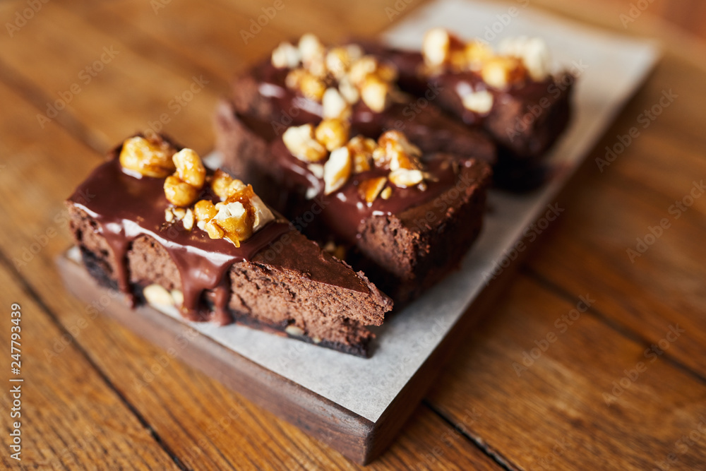Delicious slices of chocolate cake sitting on a bakery table Delicious slices of chocolate cake sitting on a bakery table