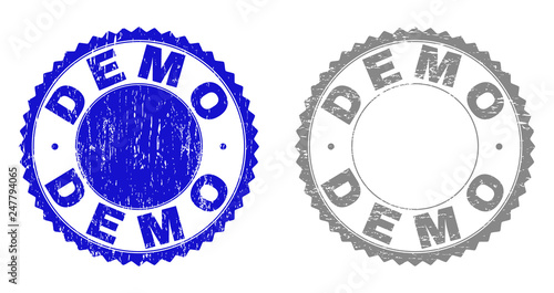 Grunge DEMO stamp seals isolated on a white background. Rosette seals with grunge texture in blue and gray colors. Vector rubber stamp imprint of DEMO label inside round rosette.