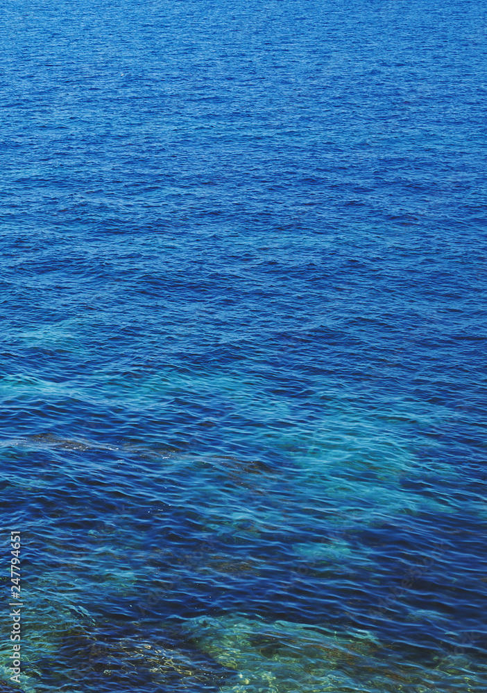  Water ripples of a lake. Blue sea water in calm.