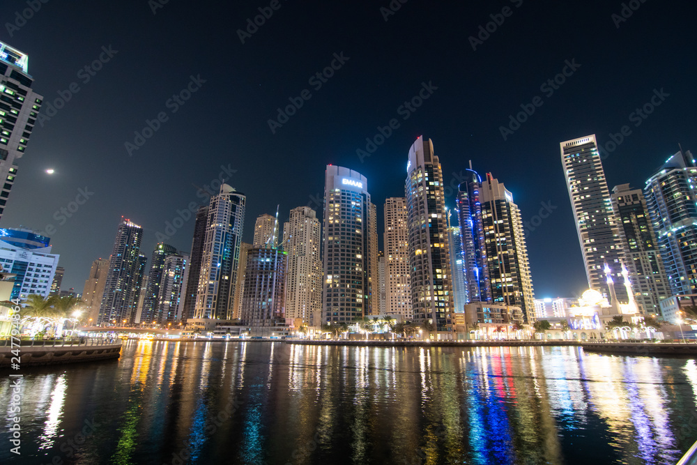 Dubai, UAE - April 2013: The skyscrappers around the marina at night