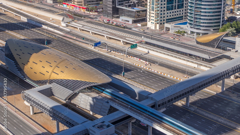 Futuristic building of Dubai metro and tram station and luxury skyscrapers behind timelapse Futuristic building of Dubai metro and tram station and luxury skyscrapers behind timelapse
