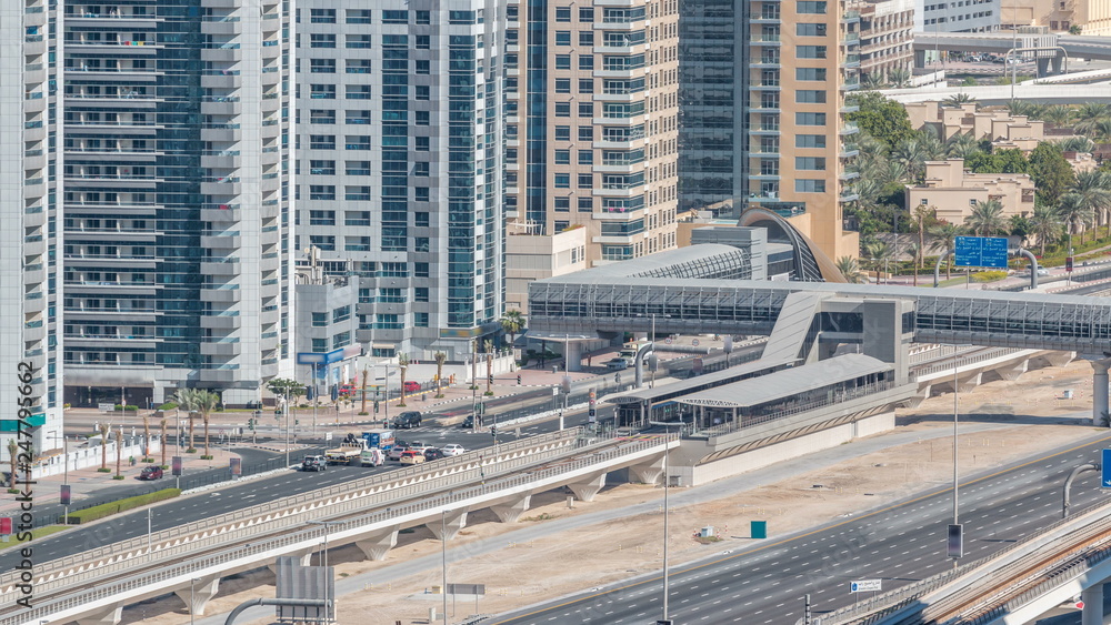 Naklejka premium Aerial view of Dubai Tram in Dubai marina timelapse.