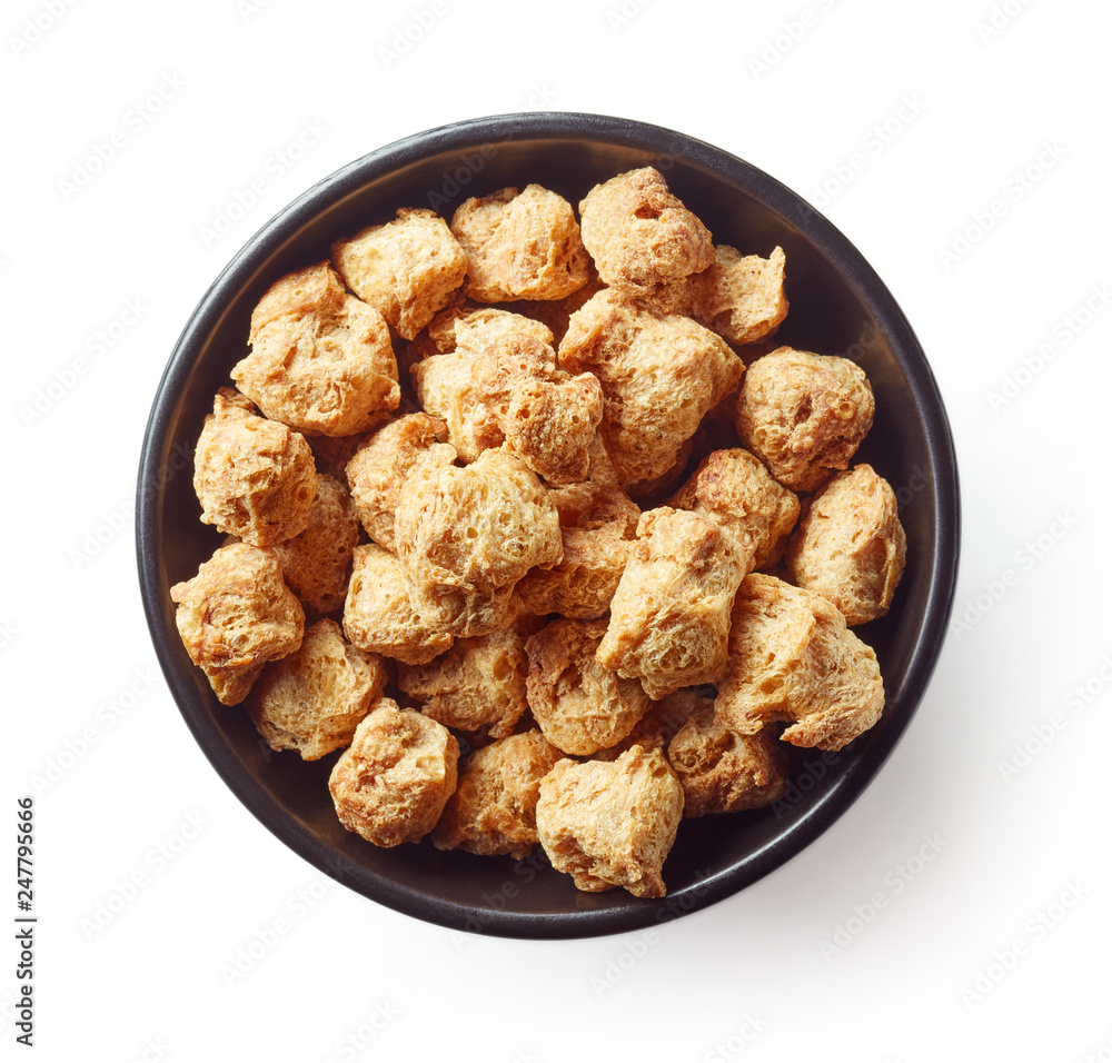 Bowl of soya chunks isolated on white, from above Bowl of soya chunks isolated on white, from above