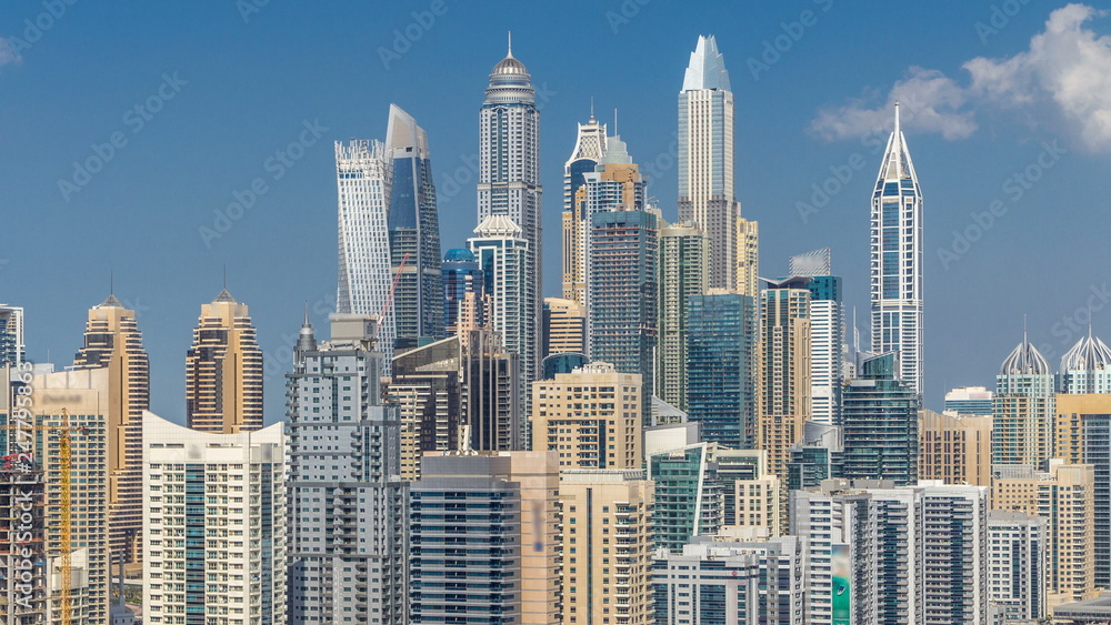Dubai Marina skyscrapers aerial top view with clouds from JLT in Dubai timelapse, UAE.