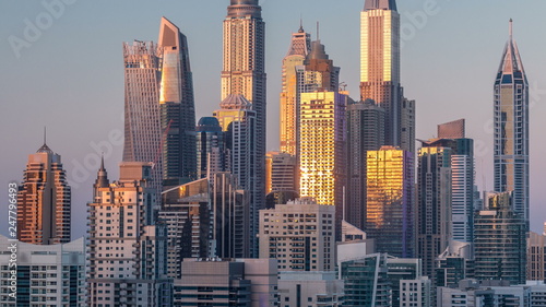Dubai Marina towers during sunset aerial timelapse, United Arab Emirates