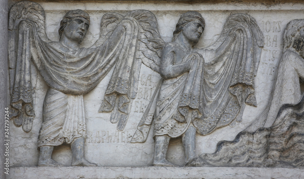 Archangels Raphael and Gabriel, detail of marble carvings on the Baptistery, Parma Emilia-Romagna Italy