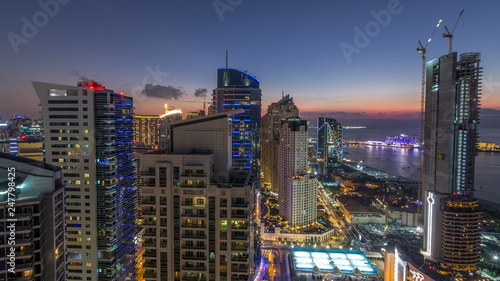 JBR and Dubai marina after sunset aerial day to night timelapse