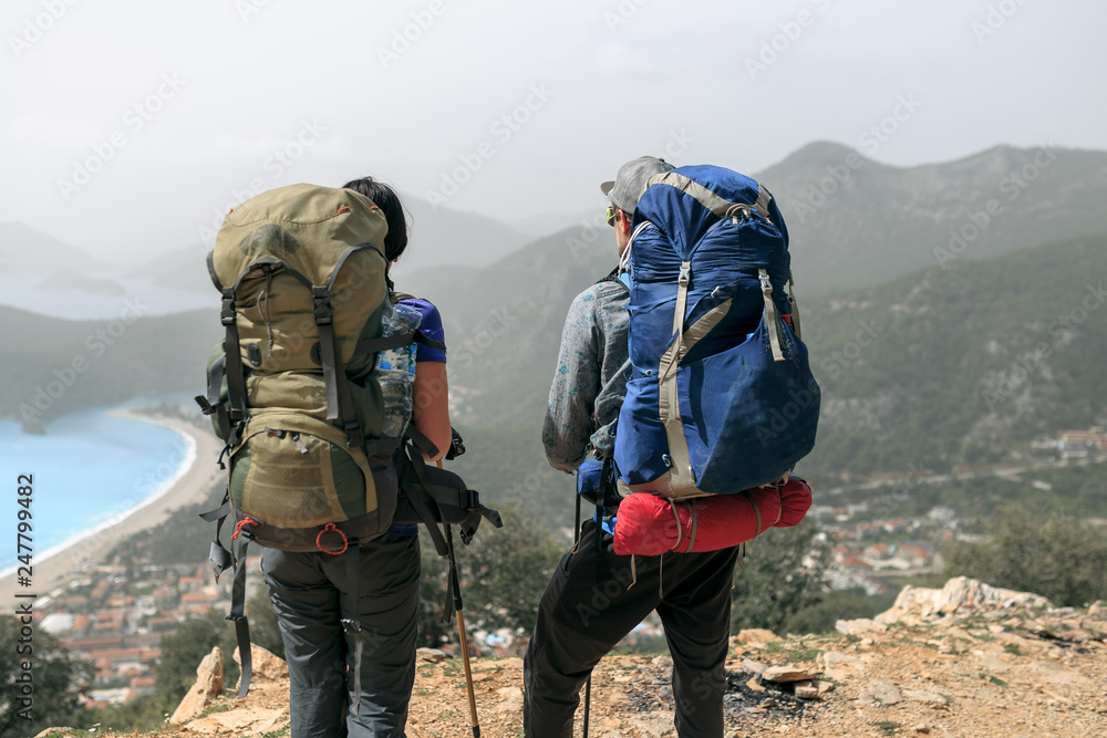 two  people hiking in the mountains