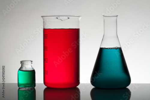 Liquid in laboratory bottles. Scientific biochemical laboratory. Colorful liquid.