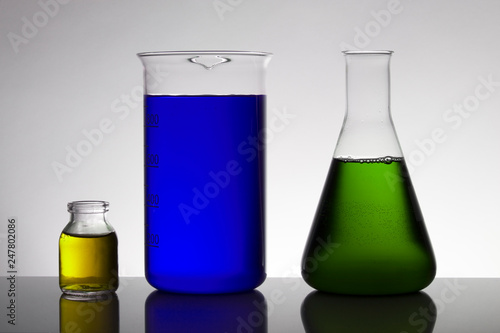 Liquid in laboratory bottles. Scientific biochemical laboratory. Colorful liquid.