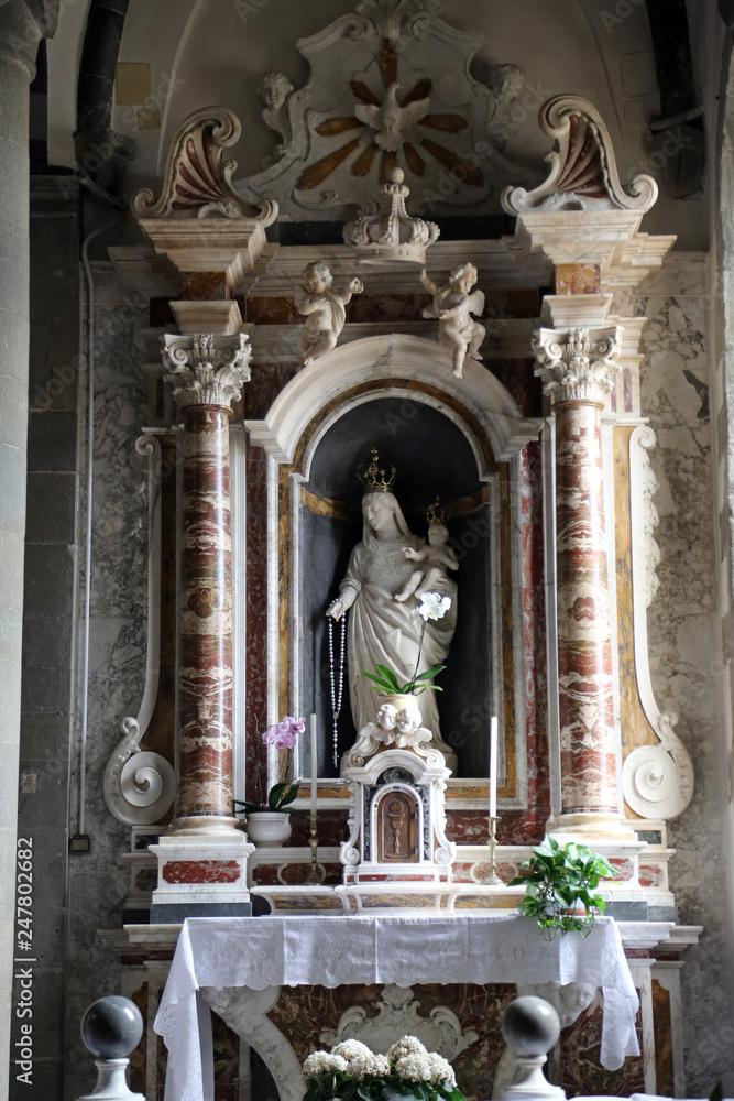The altar of the Virgin Mary with the Child in the Saint John the Baptist church in Riomaggiore, Liguria, Italy