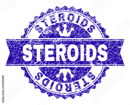STEROIDS rosette stamp watermark with grunge style. Designed with round rosette, ribbon and small crowns. Blue vector rubber watermark of STEROIDS caption with dirty style.