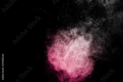 red powder effect splash for makeup artist or graphic design in black background © pariwatpannium