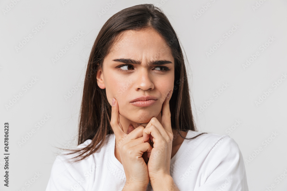 Close up portrait of a confused pretty young woman Close up portrait of a confused pretty young woman