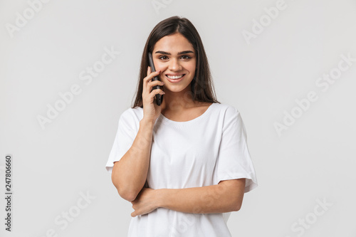 Smiling young woman casualy dressed standing