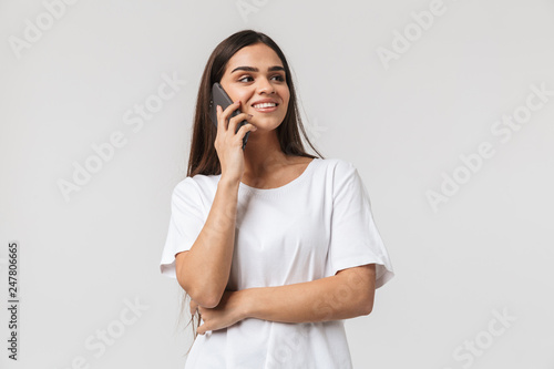 Smiling young woman casualy dressed standing