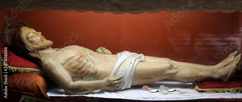 Statue of Jesus Christ in the tomb in the Church of the Holy Sacrament in Portoferraio, Elba, Italy photo