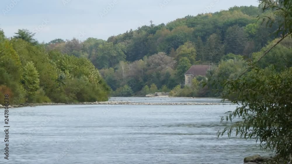 House Hidden In Trees And Water On Right Side With Water Lake Ripples And Stone Walkway Pathway House Hidden In Trees And Water On Right Side With Water Lake Ripples And Stone Walkway Pathway