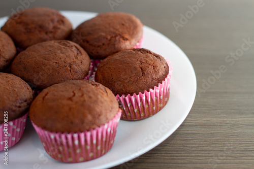 chocolate muffins on wooden table