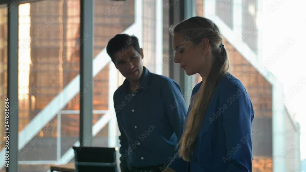 Business people using a digital tablet in a business environment