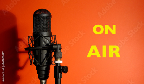 studio microphone , red background  inscription ON AIR