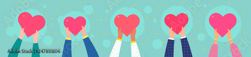 Charity concept. Several people hold the heart