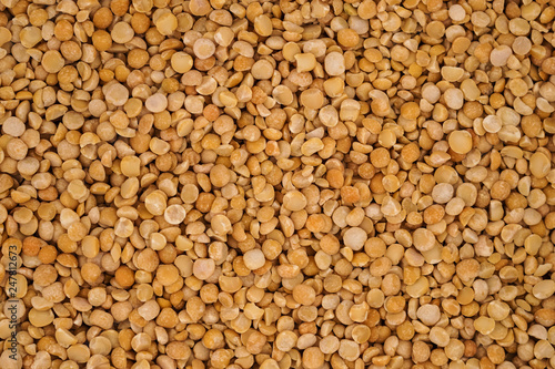 Dry yellow split peas background texture