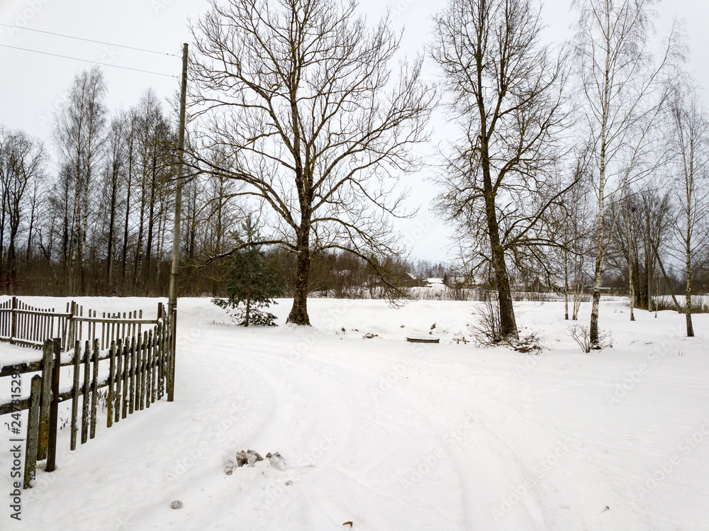 Naklejka premium deep snow covered road in winter