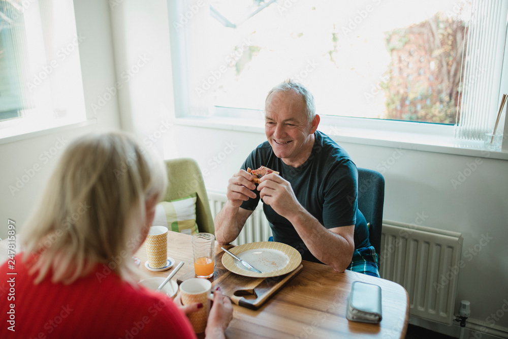 Senior Man Enjoying Breakfast With His Wife Senior Man Enjoying Breakfast With His Wife