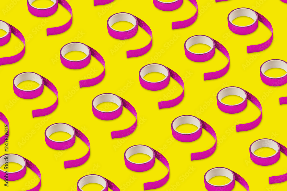 Diagonal rows of violet sticky tapes on yellow background Diagonal rows of violet sticky tapes on yellow background