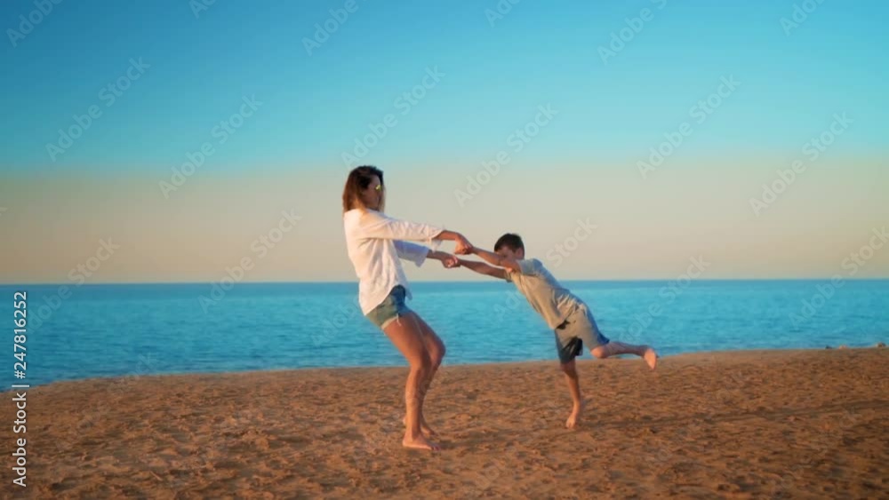 The mother and son have fun at sea The mother and son have fun at sea