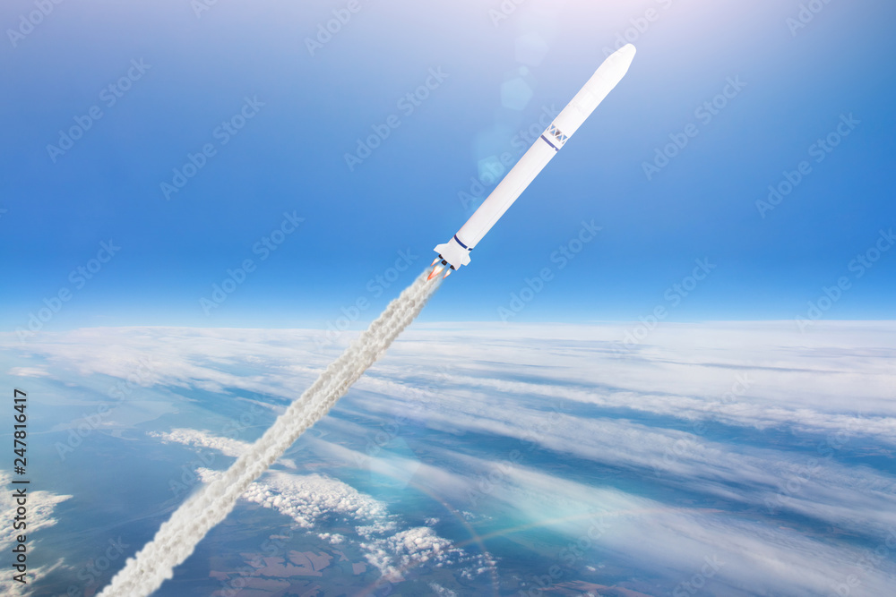 Rocket launch. Flying a spaceship above the clouds in the atmosphere of the Earth.