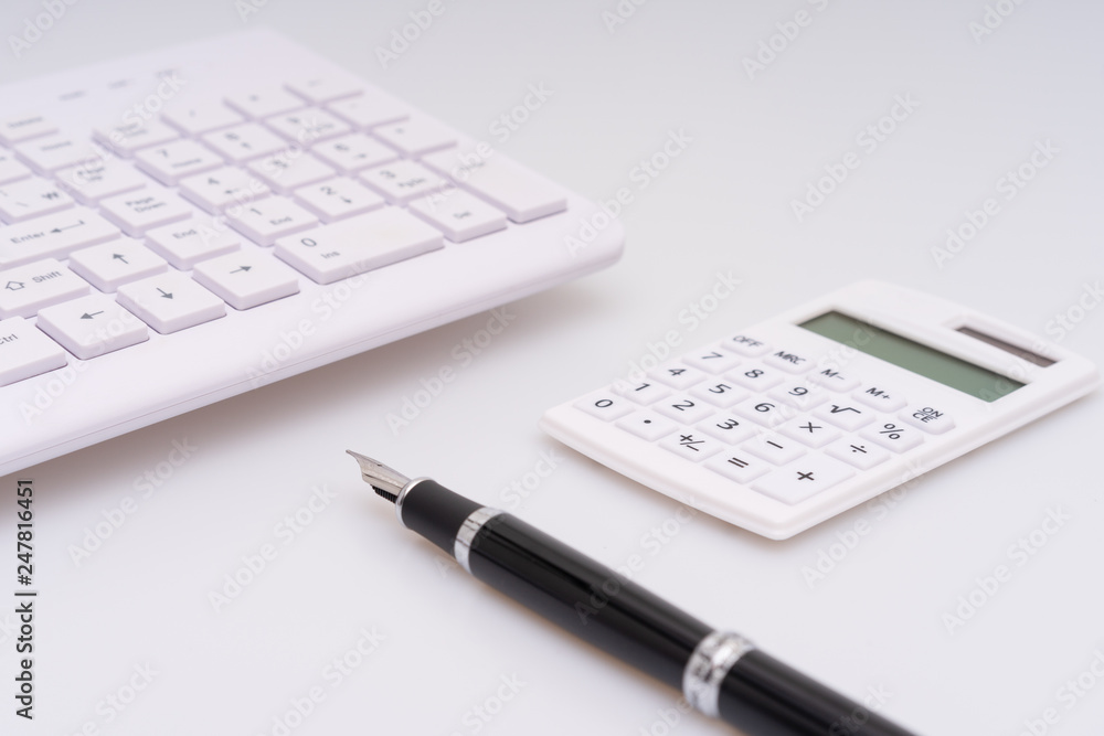 Calculator, computer keyboard and fountain pen Calculator, computer keyboard and fountain pen