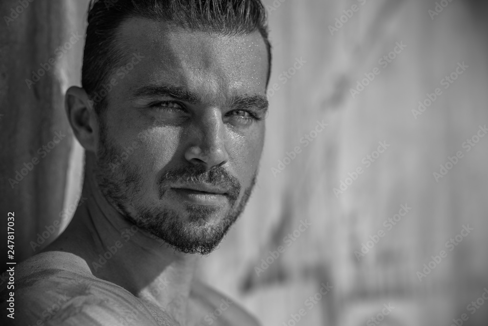 Obraz premium Handsome Caucasian Model Guy Posing on The Beach