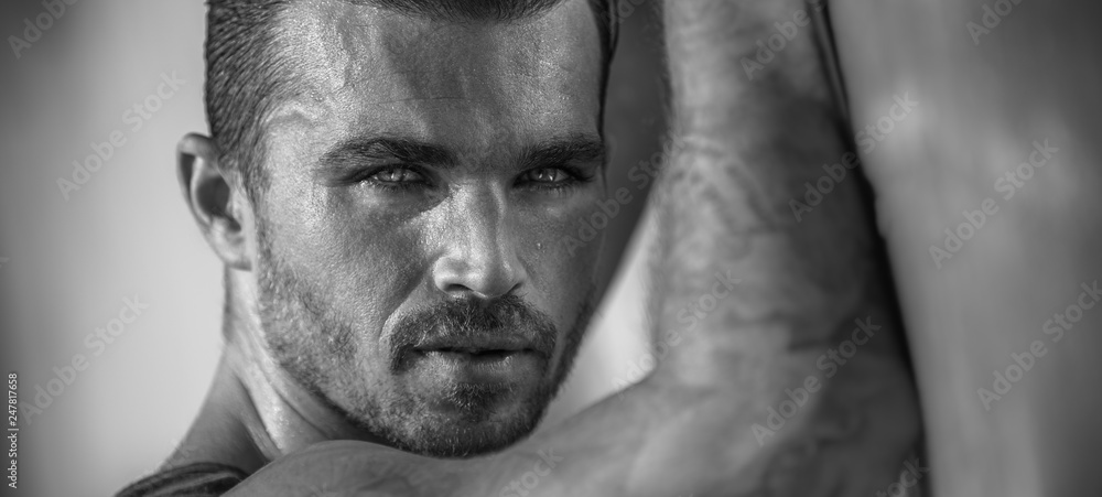 Portrait of a handsome caucasian male model posing on the beach Portrait of a handsome caucasian male model posing on the beach