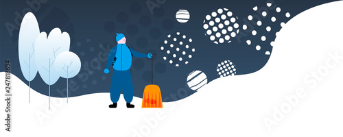 Janitor with spade near trees in winter