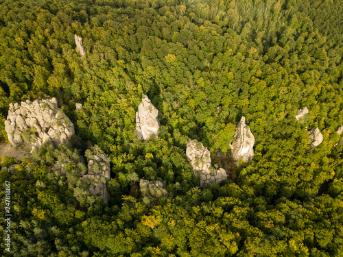 Dovbush Rocks in Bubnyshche - a legendary place, the ancient cave monastery in fantastic boulders amidst beautiful scenic forests, popular with tourists and travelers in Eastern Europe and Ukraine photo