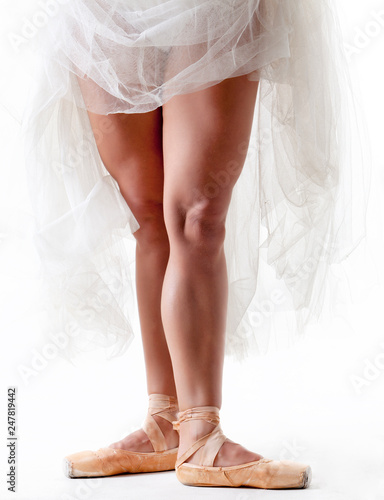 Legs of a professional ballerina in a photo studio.